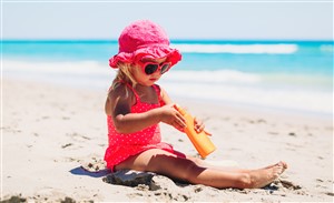 sun protection concept little girl with suncream at beach shutterstock 557242537